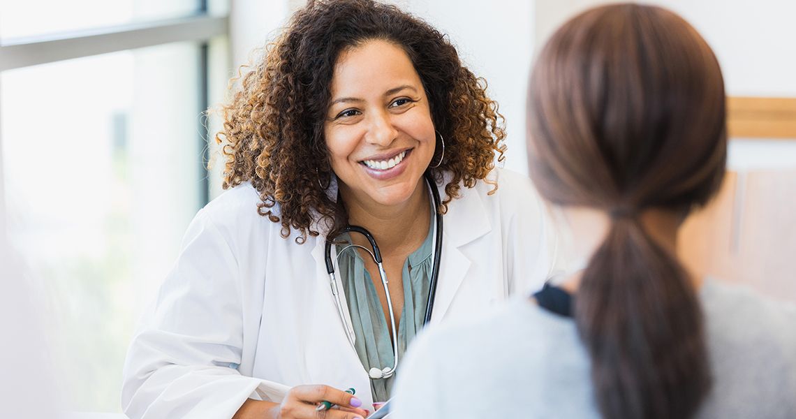 Doctor smiling at patient